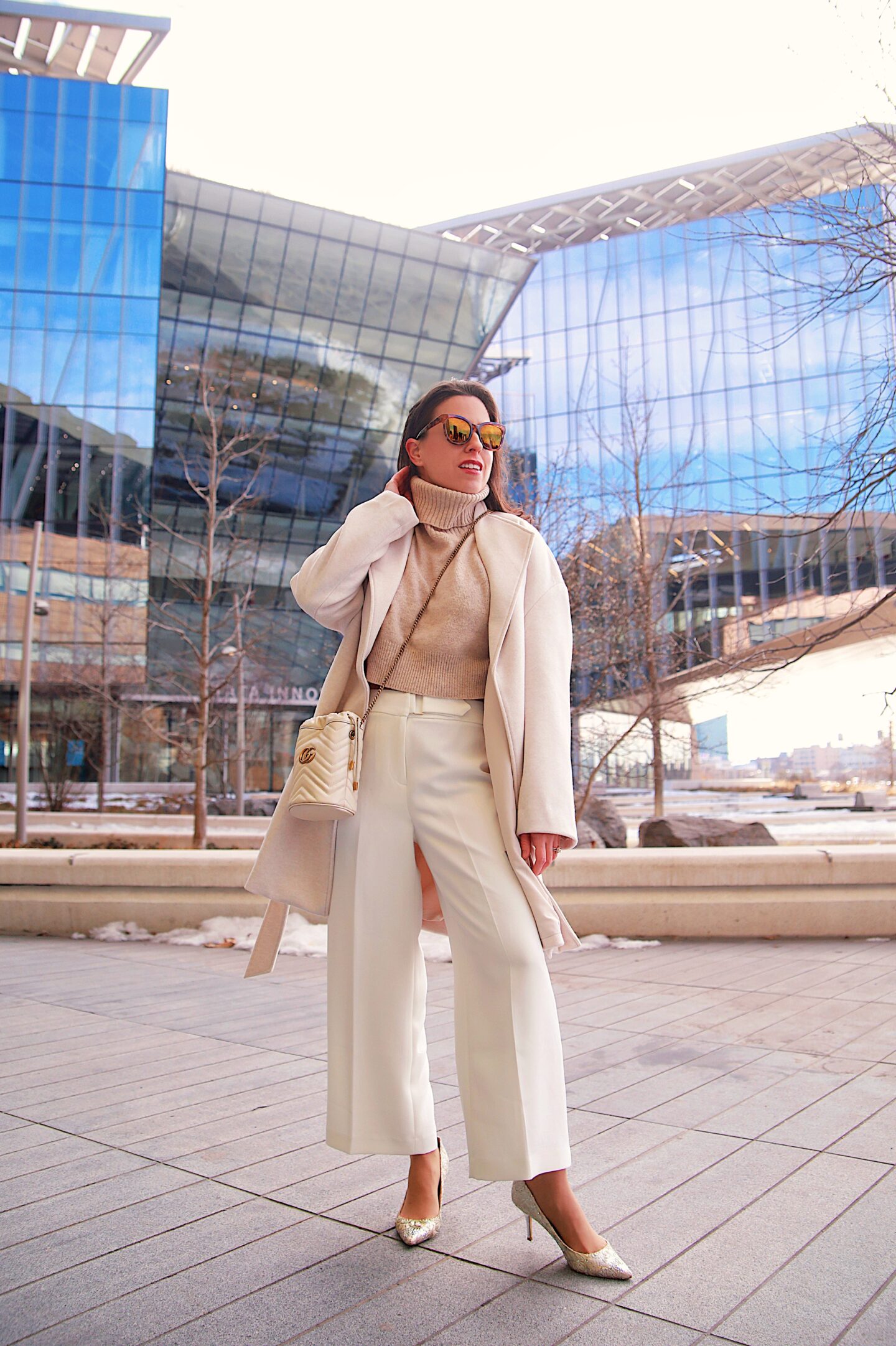 Florencia of Ana Florentina wearing tahari pants, H&M coat in New York City