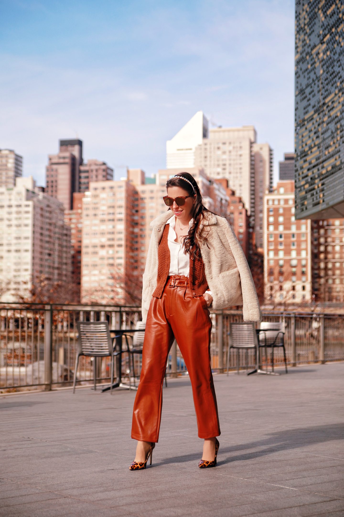 Florencia of Ana Florentina wearing faux leather pants and faux fur coat in New York City