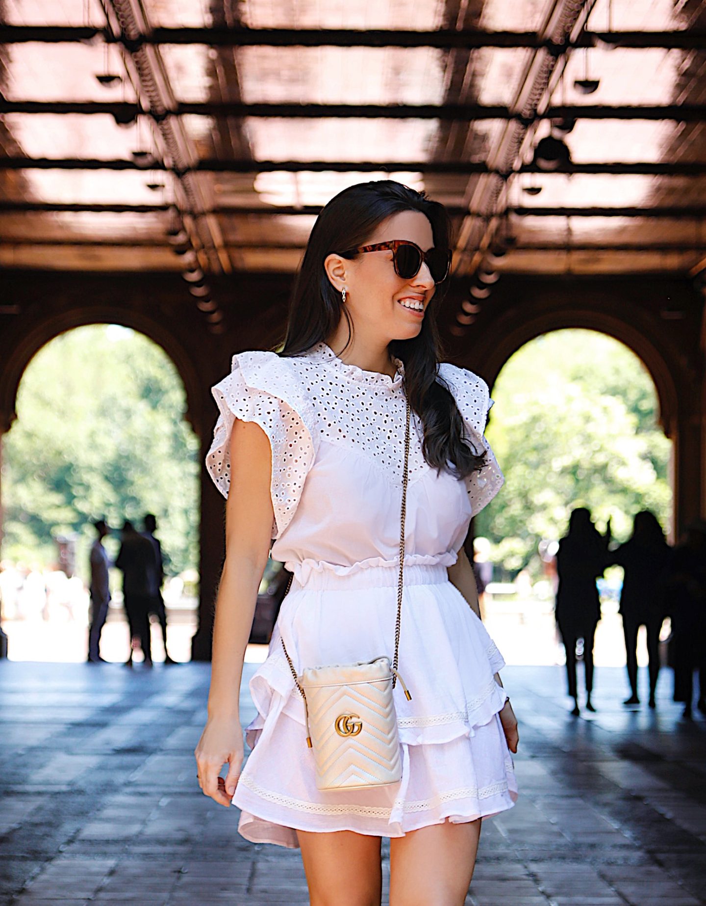 A casual eyelet top paired with a white mini skirt