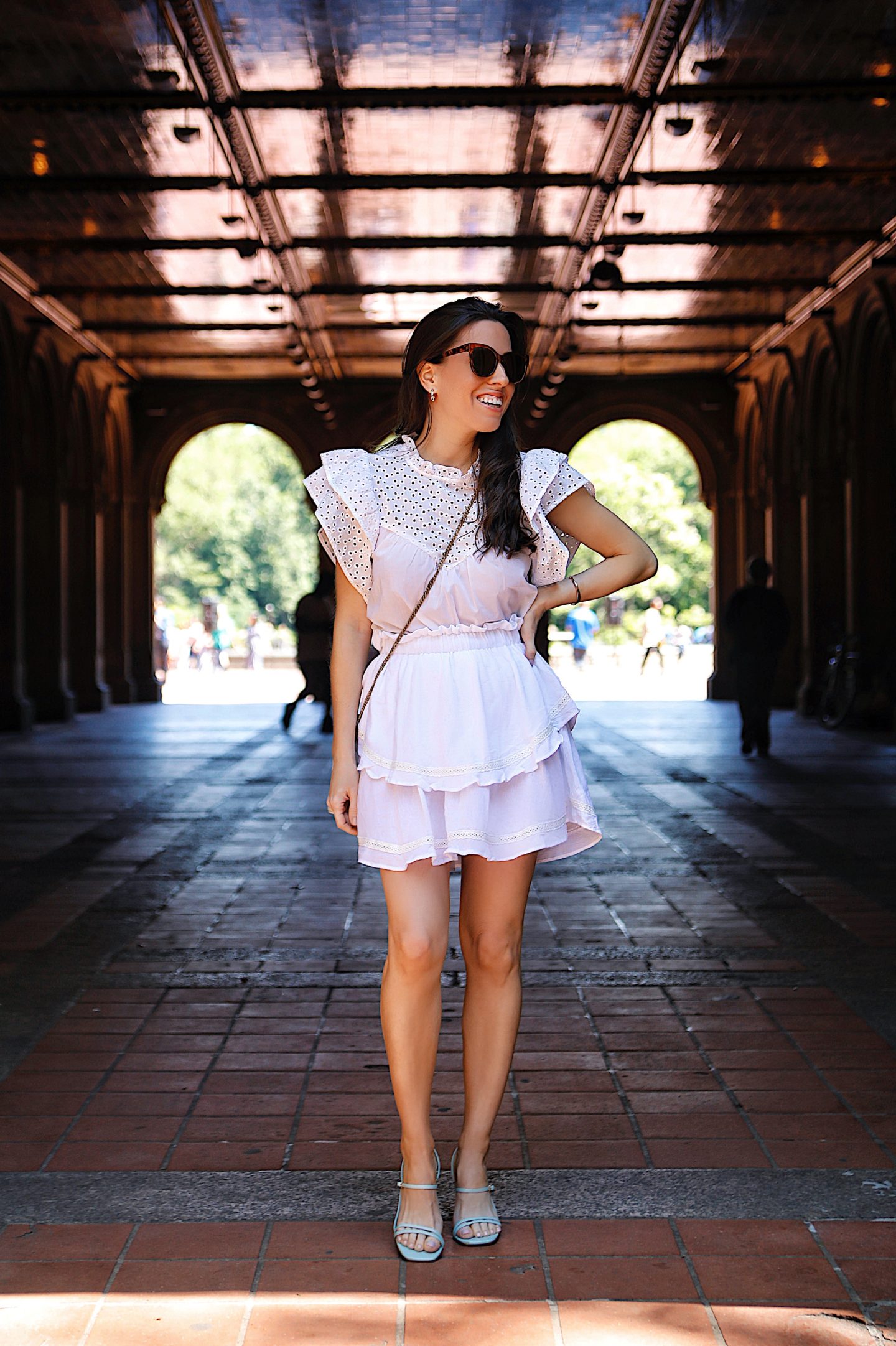 A casual eyelet top paired with a white mini skirt