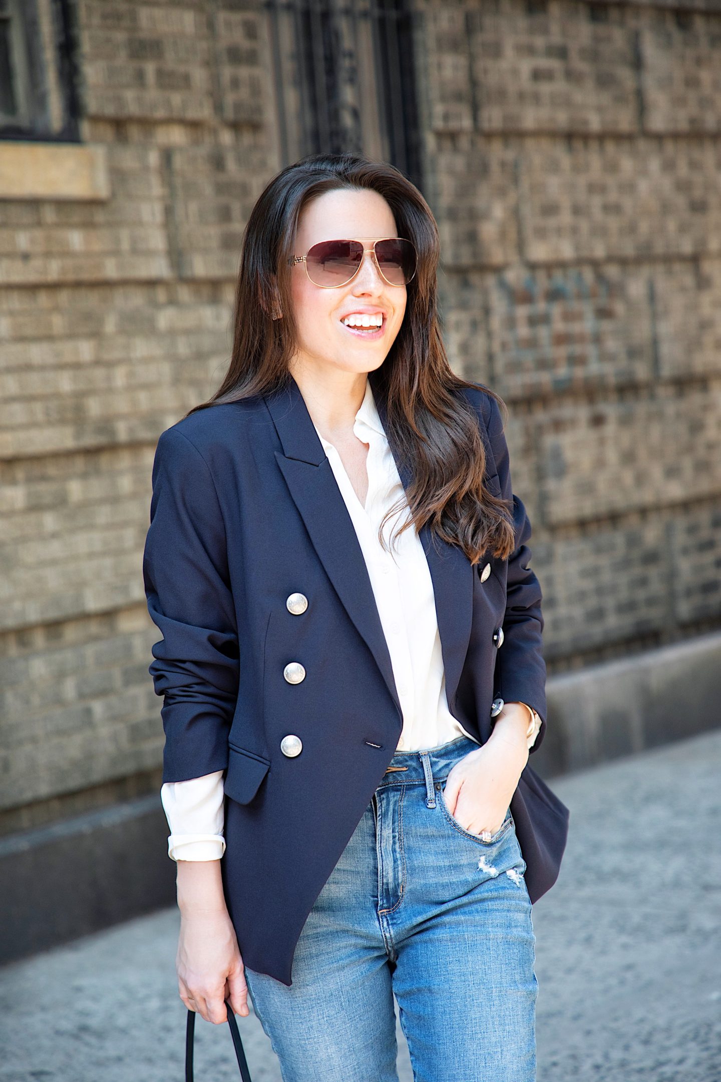 ana florentina wearing navy blazer with buttons