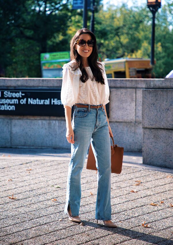 Ana Florentina wearing a white blouse and denim