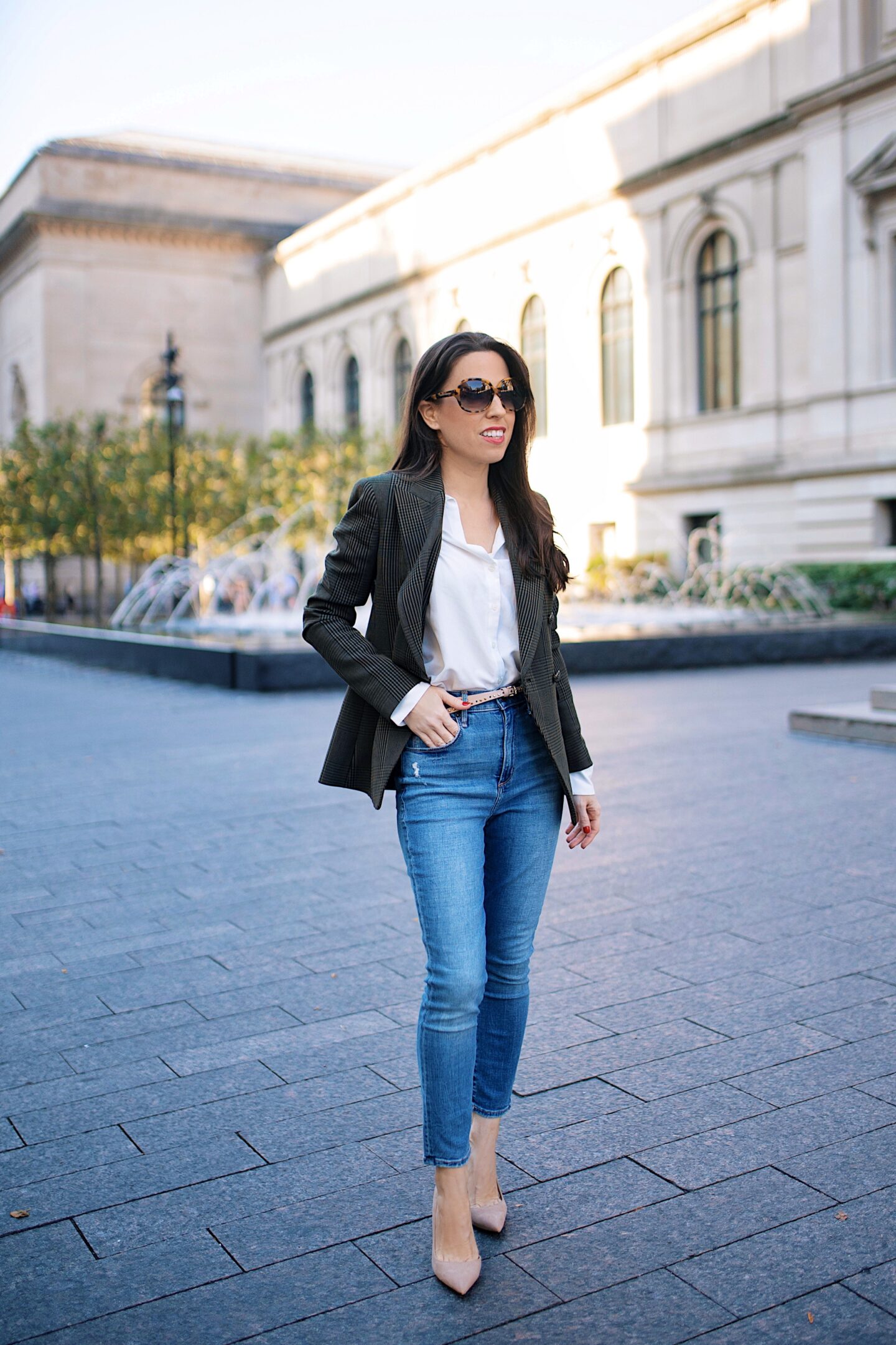 Ana Florentina fashion blogger at MET museum wearing a double breasted blazer and jeans outfit