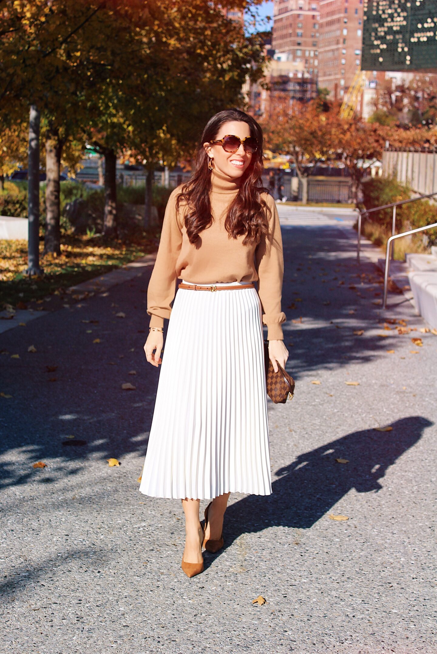 turtleneck sweater and pleated skirt