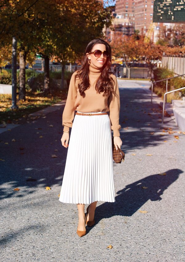 turtleneck sweater and pleated skirt